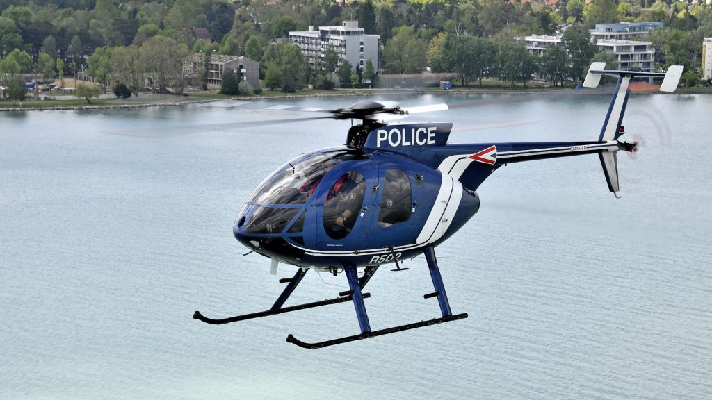 Police helicopter flying over water