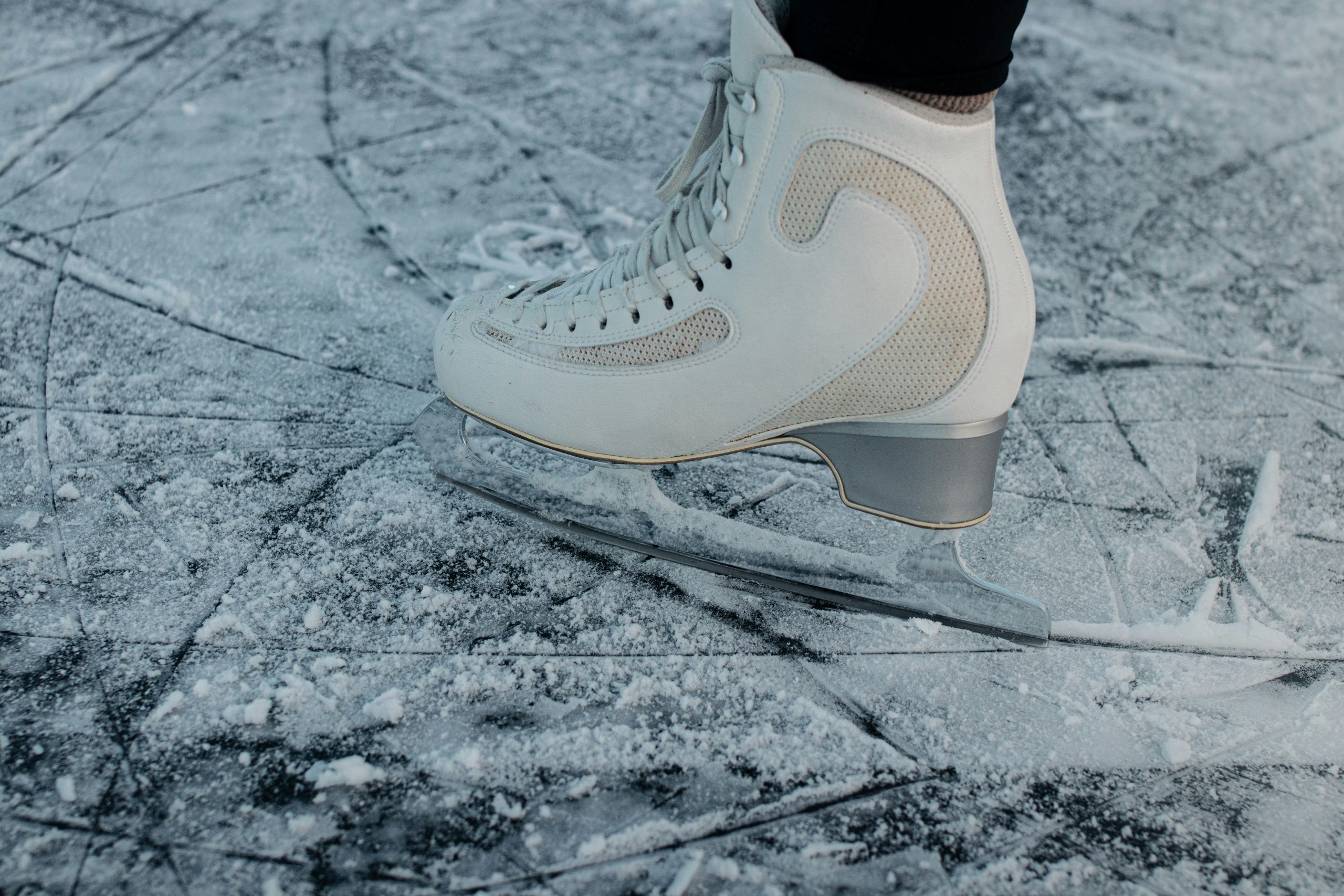 Ice skate on frozen surface.
