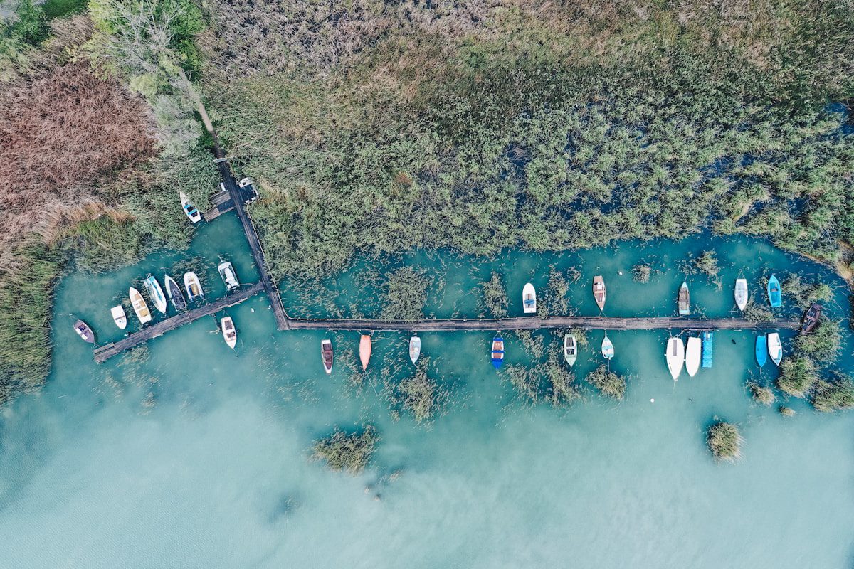 Boats docked in a serene waterway.