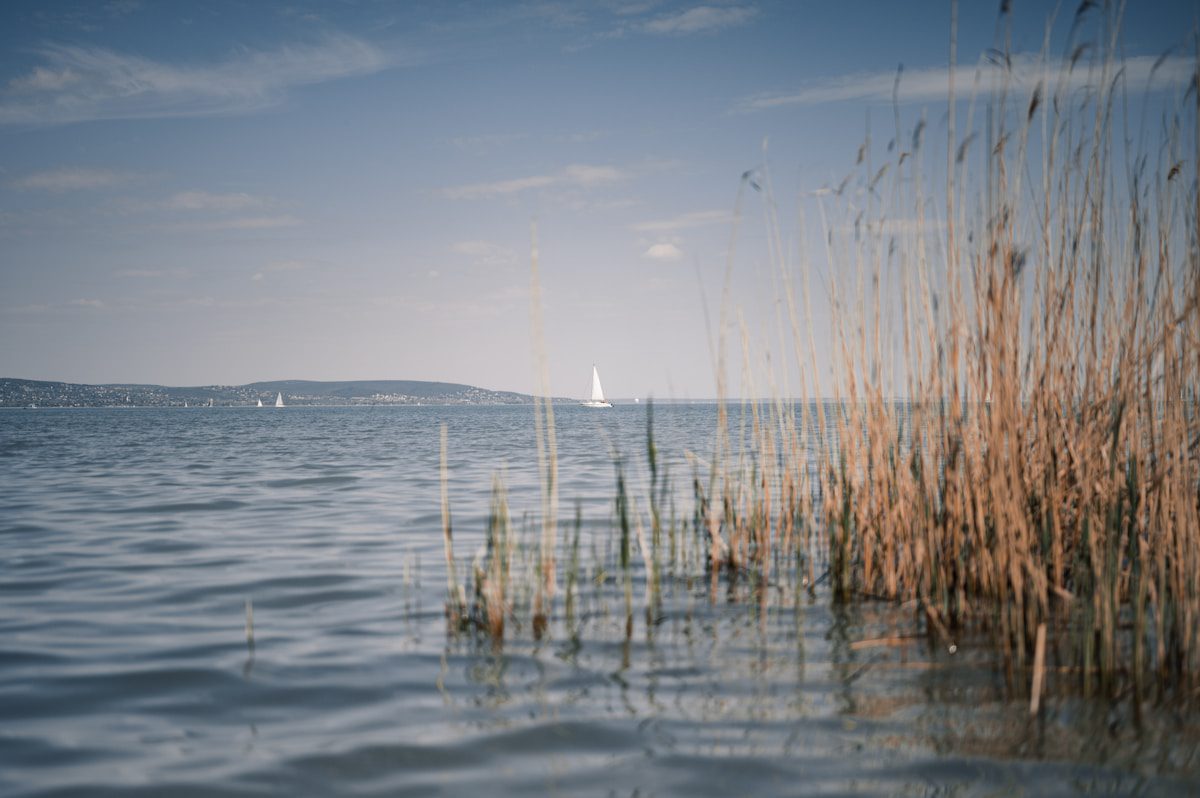 Sailboat on calm lake water